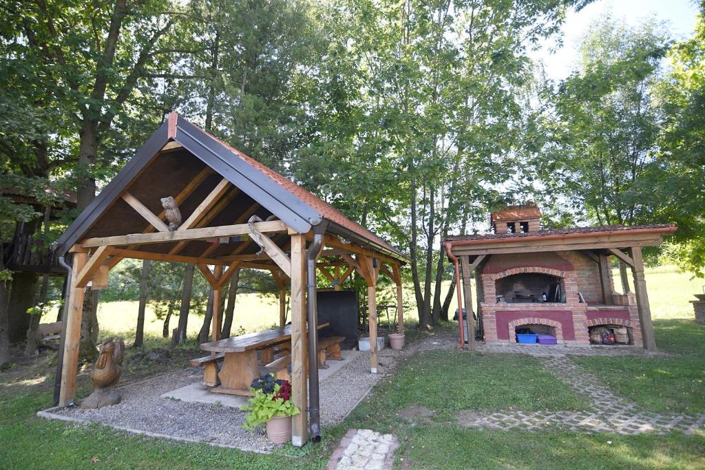 The outdoor kitchen and traditional brick BBQ
